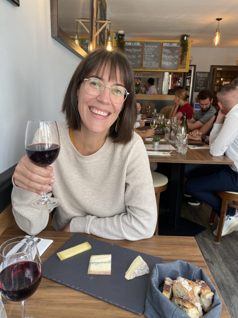 Laura enjoying a glass of red wine in Burgundy, France